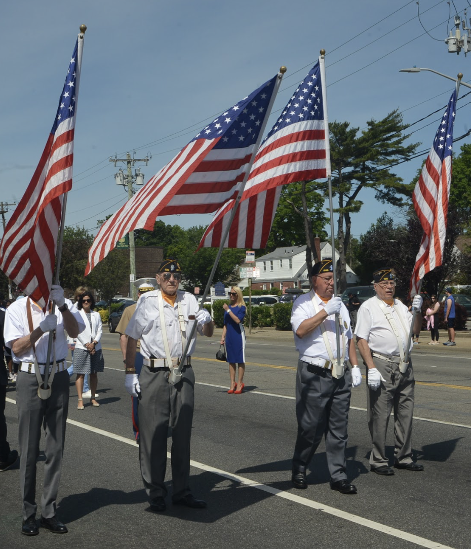 American Legion members carry flags